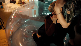 Two tasty guys share an inflatable stool